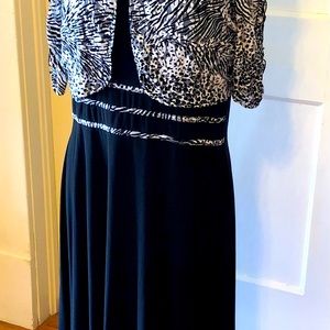 Jersey black tea length dress with matching jacket. Very easy care & wear.